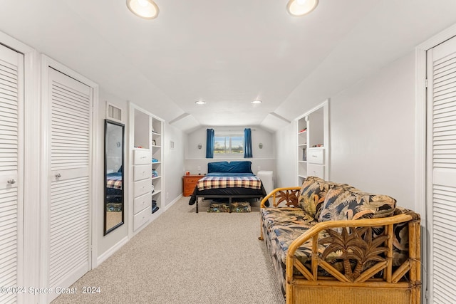 carpeted bedroom featuring lofted ceiling