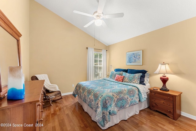 bedroom featuring high vaulted ceiling, ceiling fan, and wood-type flooring