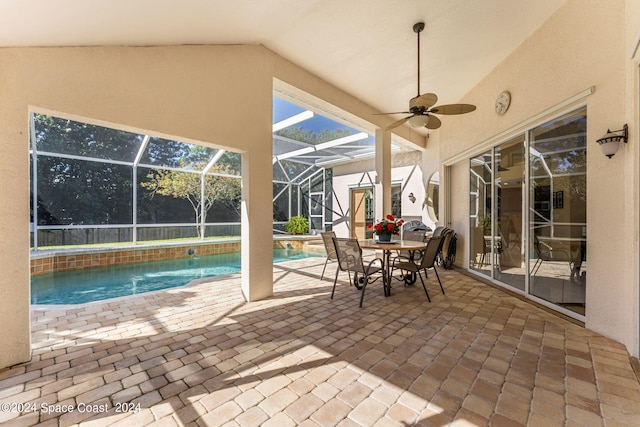 view of patio / terrace featuring ceiling fan and a lanai