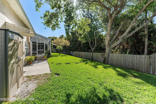 view of yard featuring a lanai and a patio