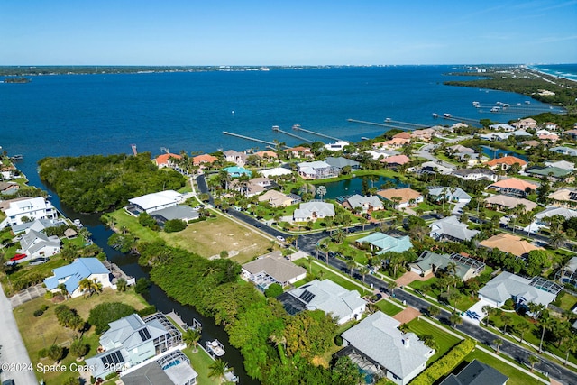 birds eye view of property with a water view