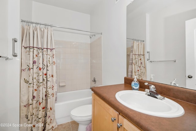 full bathroom with tile patterned floors, shower / bath combo, toilet, and vanity