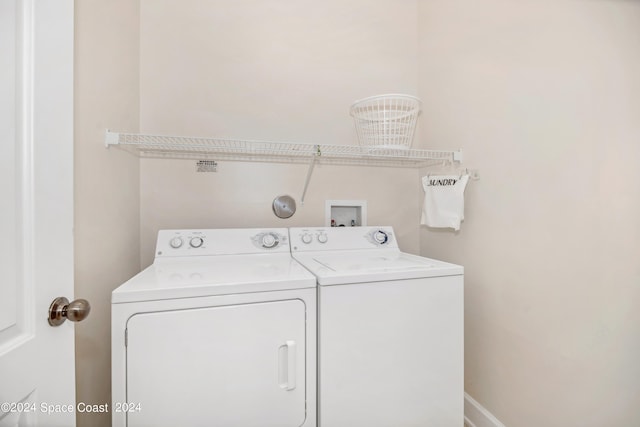 washroom with washer and dryer