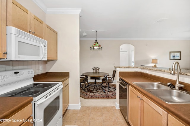 kitchen featuring white appliances, light tile patterned floors, decorative light fixtures, sink, and decorative backsplash