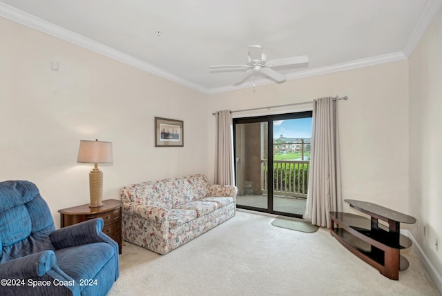 carpeted living room with ceiling fan and ornamental molding