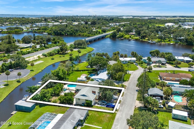 birds eye view of property with a water view