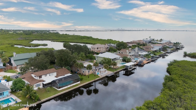 birds eye view of property with a water view