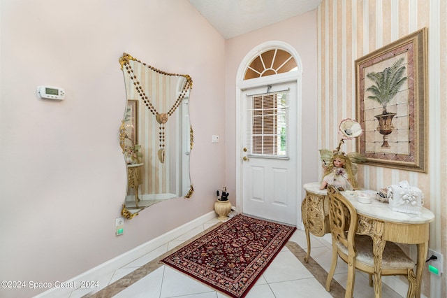 interior space with vaulted ceiling and a textured ceiling