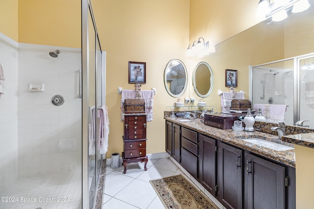 bathroom with vanity, tile patterned floors, and walk in shower