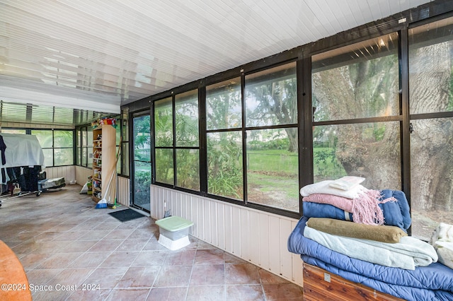 sunroom / solarium featuring a healthy amount of sunlight