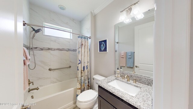 full bathroom featuring vanity, toilet, ornamental molding, and shower / bathtub combination with curtain