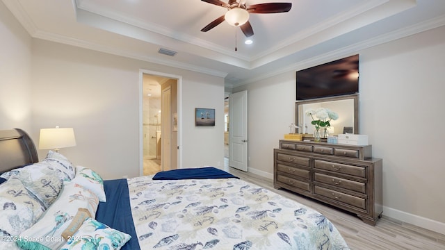 362 Tiki Ter, Daytona Beach, FL 32124 - bedroom with visible vents, crown molding, light wood finished floors, baseboards, and a tray ceiling