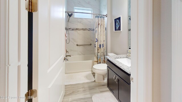 full bathroom featuring vanity, toilet, and shower / bath combo