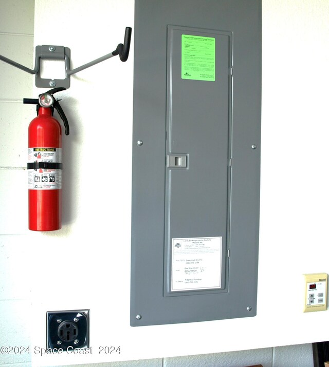 utility room featuring electric panel