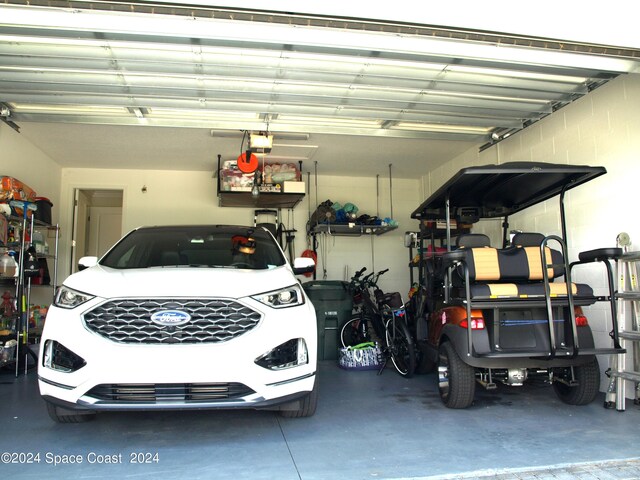 garage featuring a garage door opener