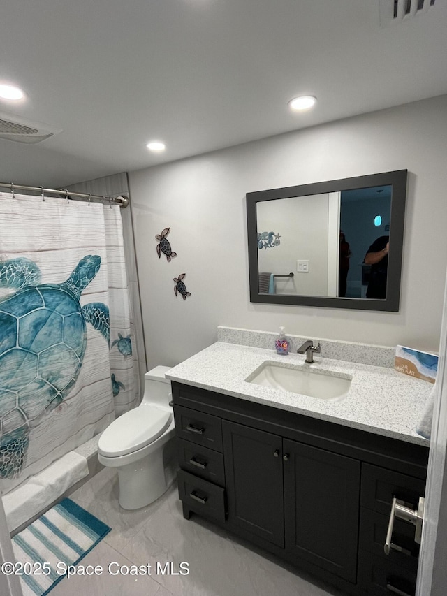 bathroom with vanity, a shower with curtain, and toilet