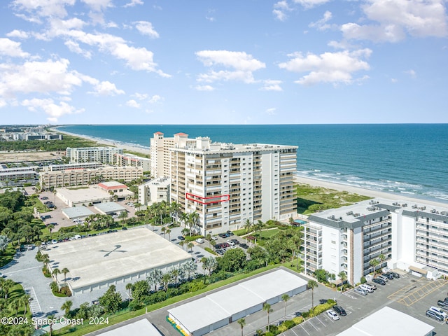 aerial view featuring a water view and a view of the beach