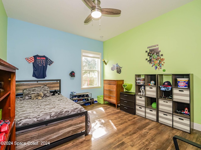 bedroom featuring dark wood-type flooring and ceiling fan