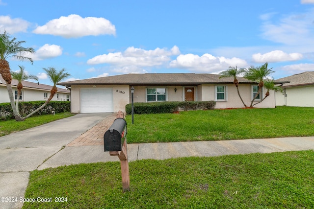 single story home with a garage and a front yard