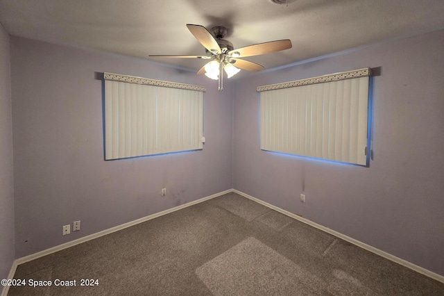 unfurnished room featuring carpet and ceiling fan