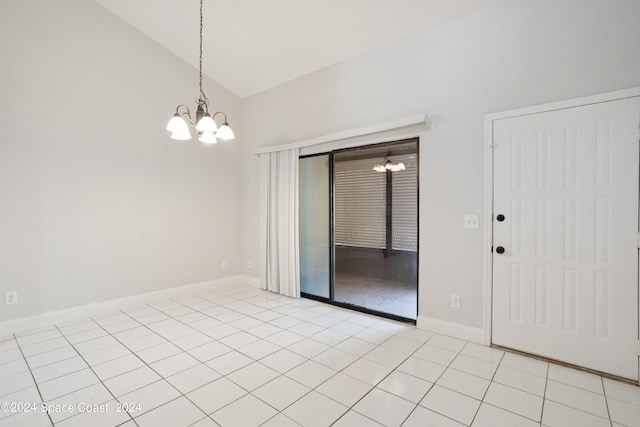 unfurnished room with light tile patterned floors, baseboards, lofted ceiling, and a chandelier