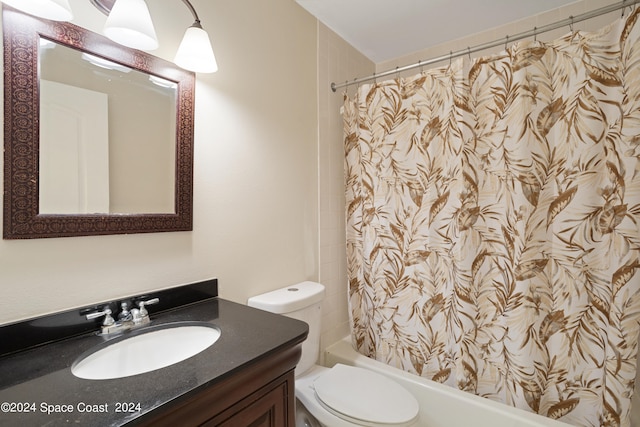 full bathroom with shower / bathtub combination with curtain, toilet, and vanity