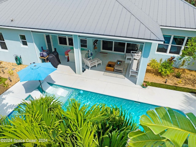 view of swimming pool with a patio