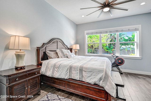 bedroom featuring dark hardwood / wood-style floors and ceiling fan