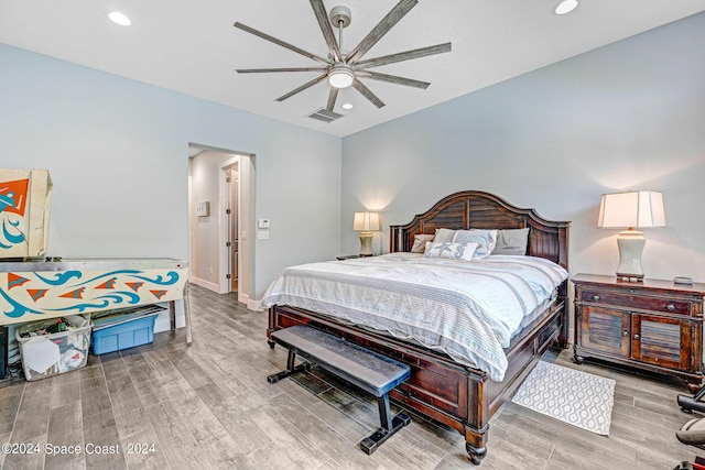 bedroom with ceiling fan and hardwood / wood-style flooring