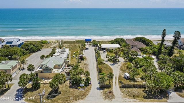 bird's eye view featuring a view of the beach and a water view