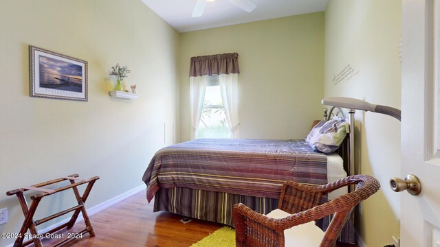 bedroom featuring hardwood / wood-style flooring and ceiling fan