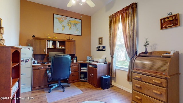 home office featuring ceiling fan and light hardwood / wood-style floors