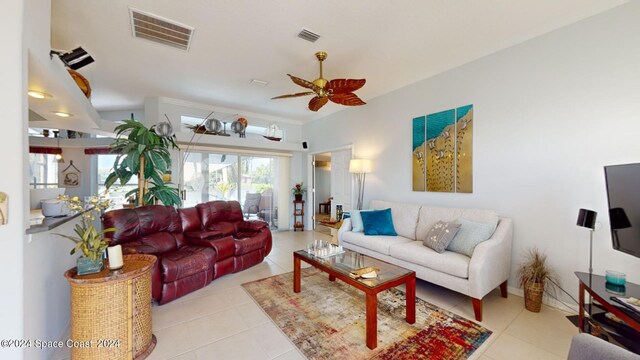 tiled living room with ceiling fan