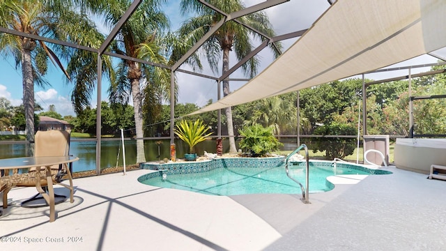 view of pool with a water view, a lanai, and a patio area