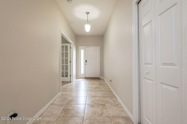 doorway featuring light tile patterned floors