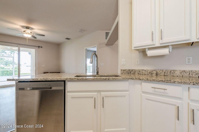 kitchen with dishwasher, white cabinetry, light stone countertops, and sink