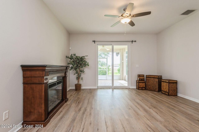 interior space with ceiling fan and light hardwood / wood-style floors