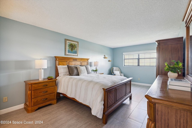 bedroom with a textured ceiling