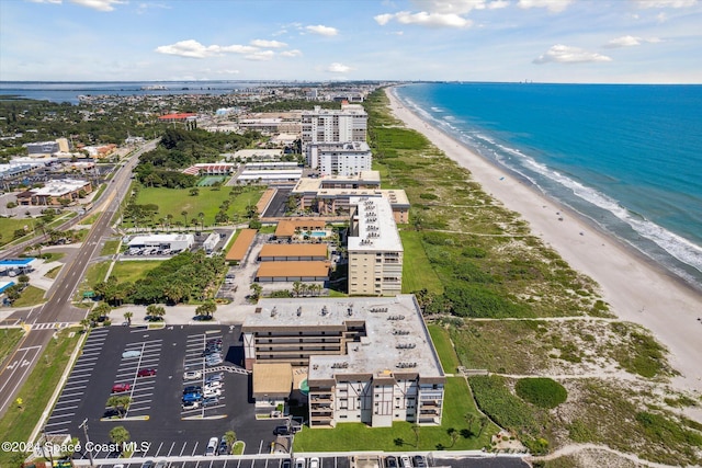 aerial view with a view of the beach and a water view