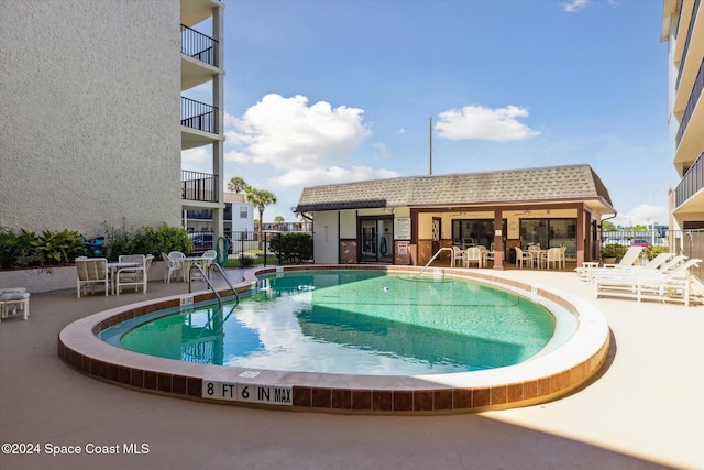 view of swimming pool featuring a patio