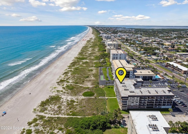 bird's eye view with a beach view and a water view