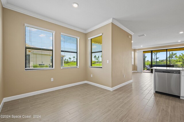 interior space with plenty of natural light, light hardwood / wood-style flooring, and stainless steel dishwasher