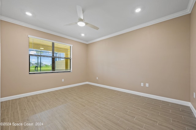 empty room featuring ceiling fan, light hardwood / wood-style floors, and ornamental molding