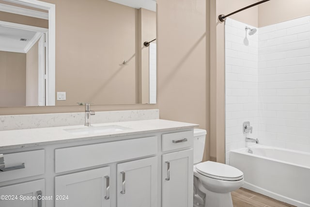 full bath featuring visible vents, shower / bathing tub combination, toilet, vanity, and wood finished floors