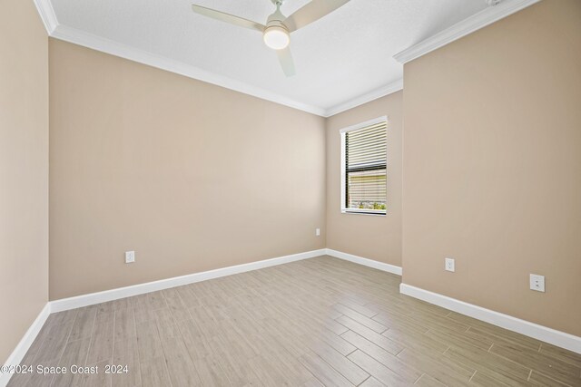 unfurnished room with light wood-type flooring, ceiling fan, and crown molding