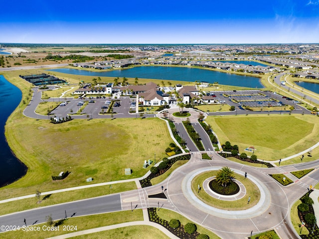 birds eye view of property with a water view