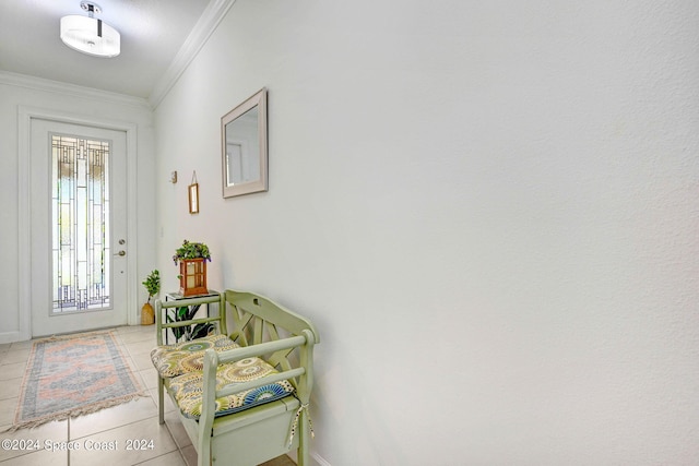 tiled foyer with ornamental molding