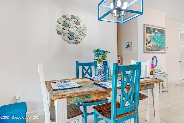 dining room featuring light tile patterned floors, a notable chandelier, and ornamental molding