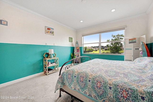 bedroom featuring recessed lighting, crown molding, baseboards, and carpet floors