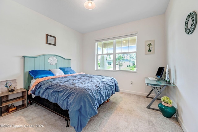 bedroom with carpet flooring and baseboards